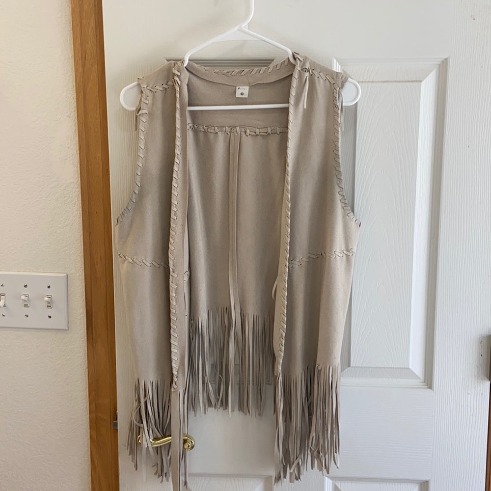 Cream colored fringe vest. Fits like M